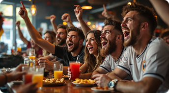 Grupo de amigos celebrando en un sportsbar con pantallas HD
